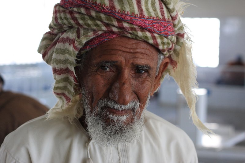 An elderly gentleman at the fish souk in Muscat