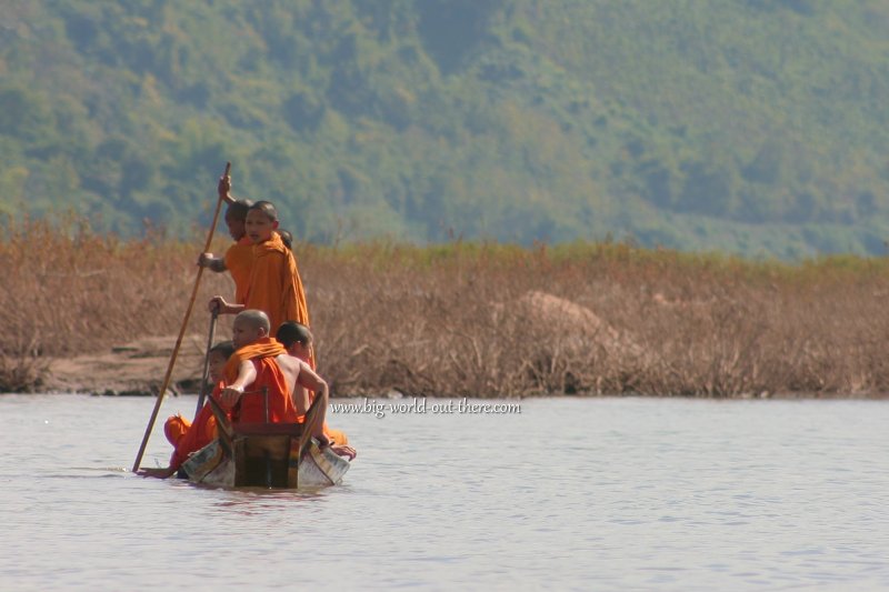 Novice monks crossing the Mekong in Laos