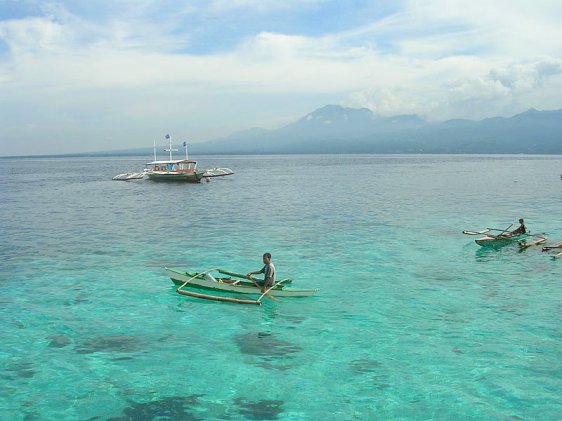 Fishermen off Negros, in the background