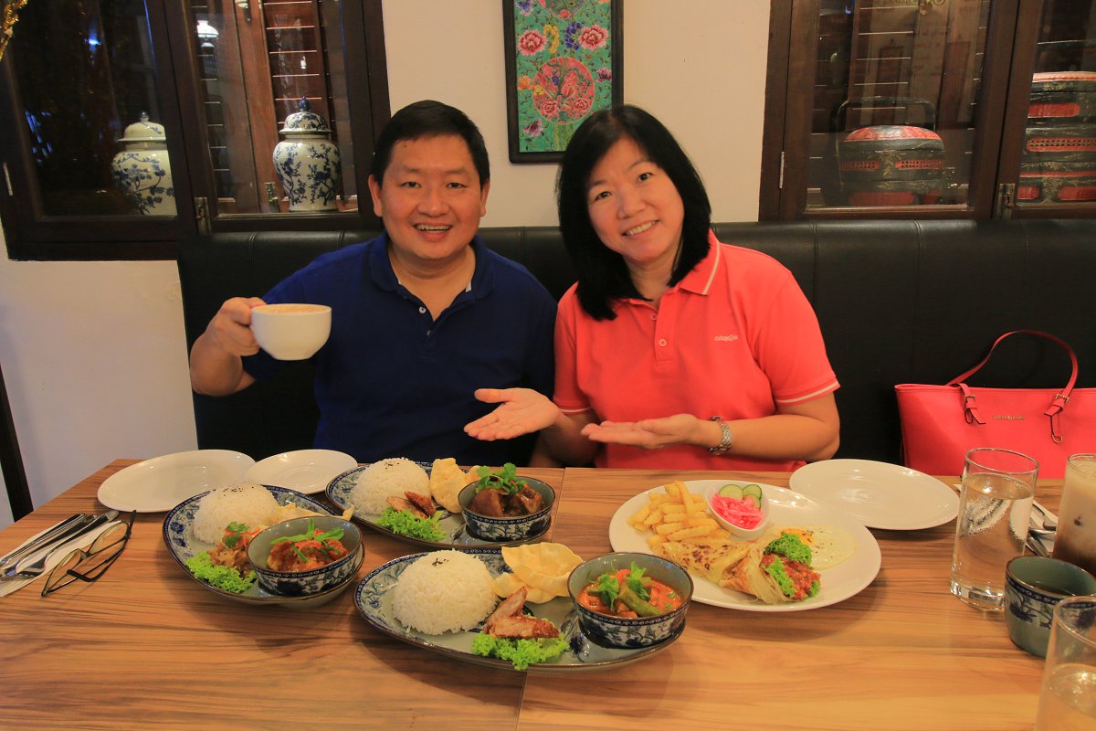 My wife and I with the food served to us by Areca Hotel