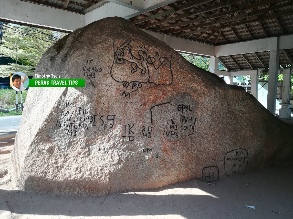 Façade of Batu Bersurat Pangkor with its inscriptions.