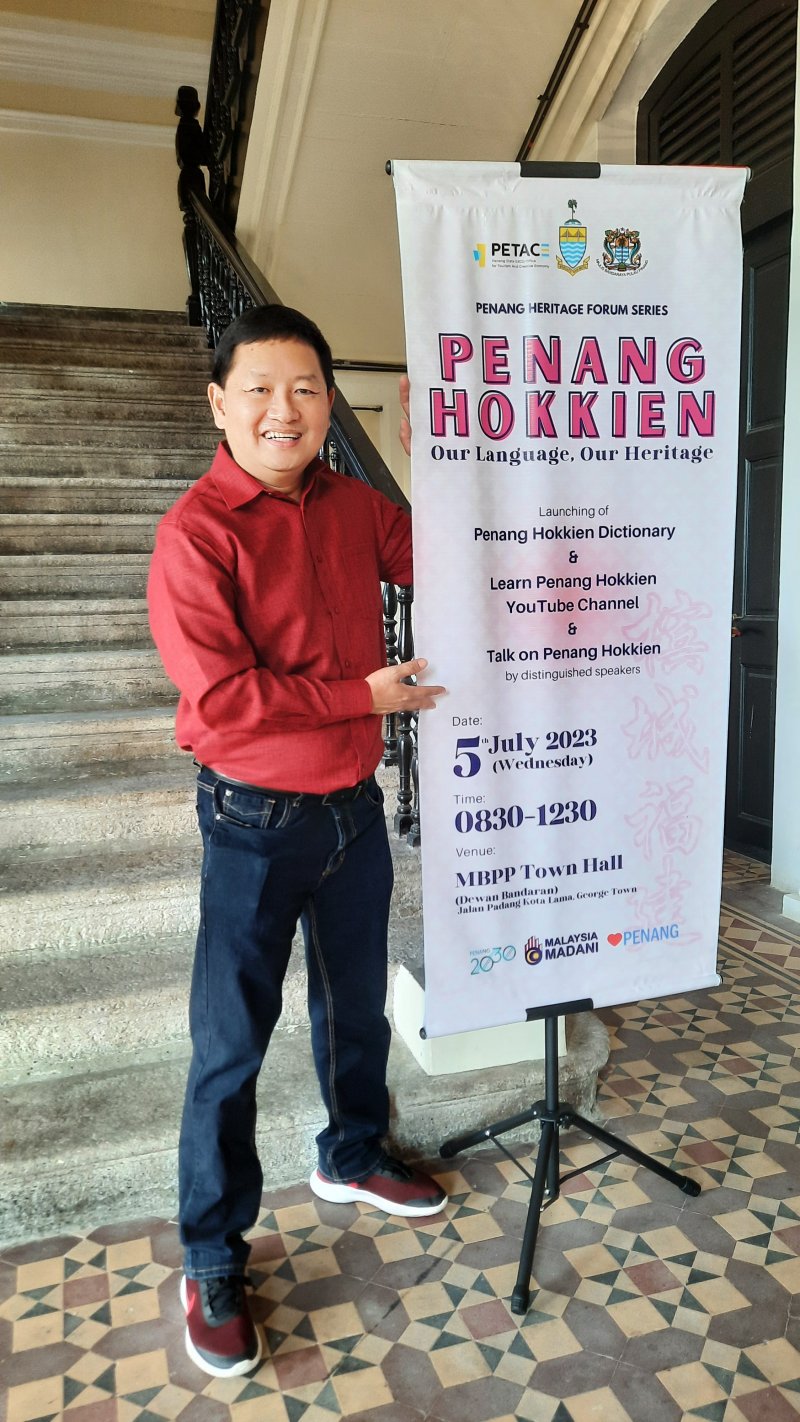 With the banner: Penang Hokkien, Our Language, Our Heritage