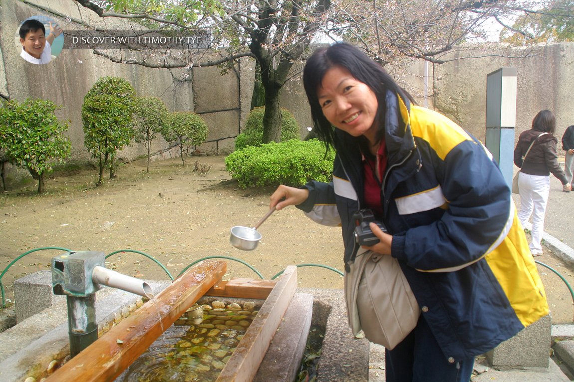 My wife with the drinking water at Osaka Castle