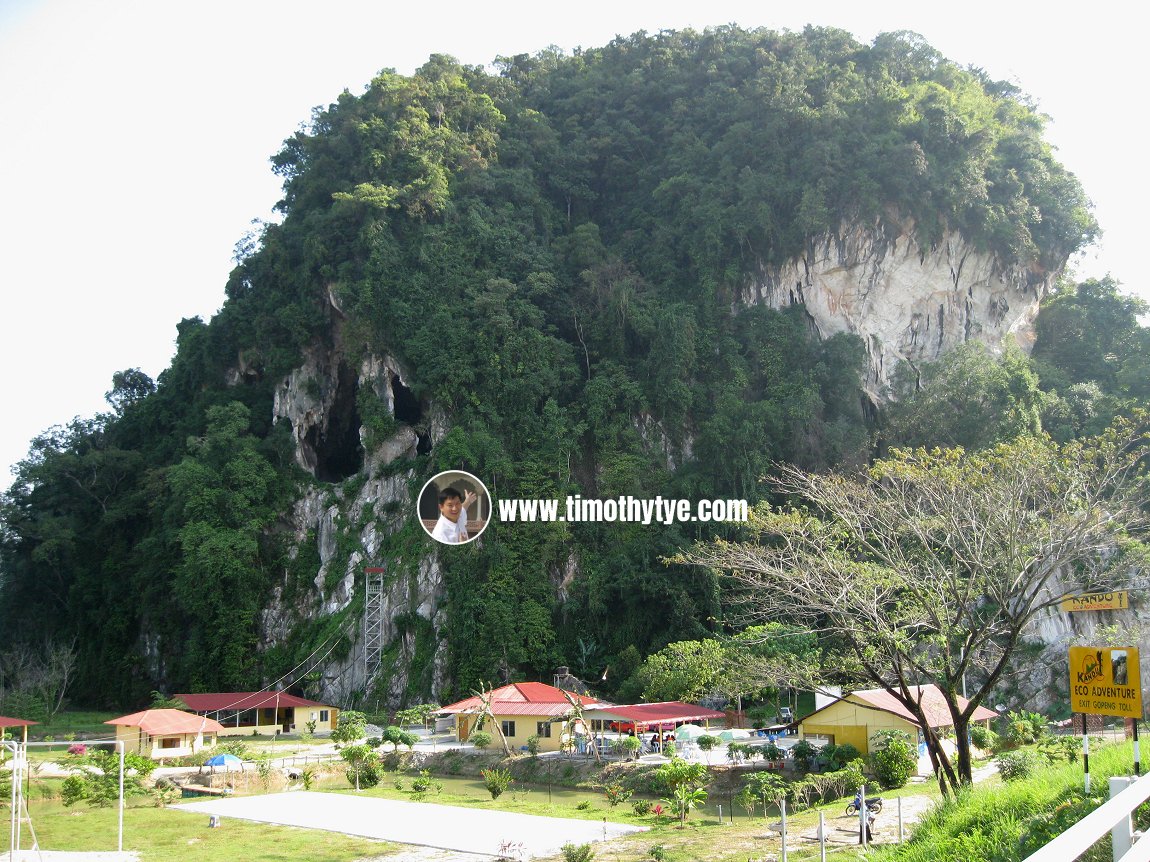 View of Gua Kandu, with the karst outcrop, from afar.