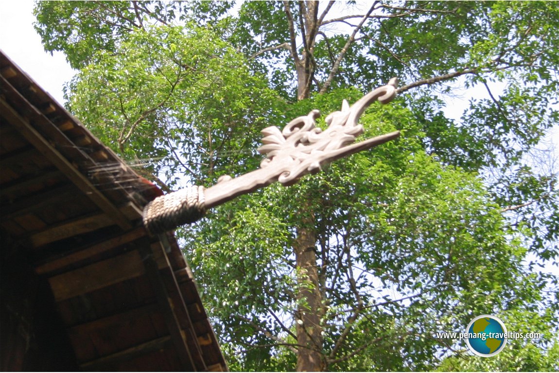 A stylized hornbill finial at the gable of the Iban longhouse