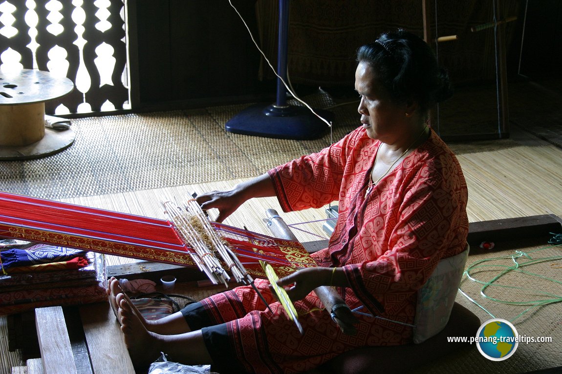 Iban woman weaving the pua at the Sarawak Cultural Village