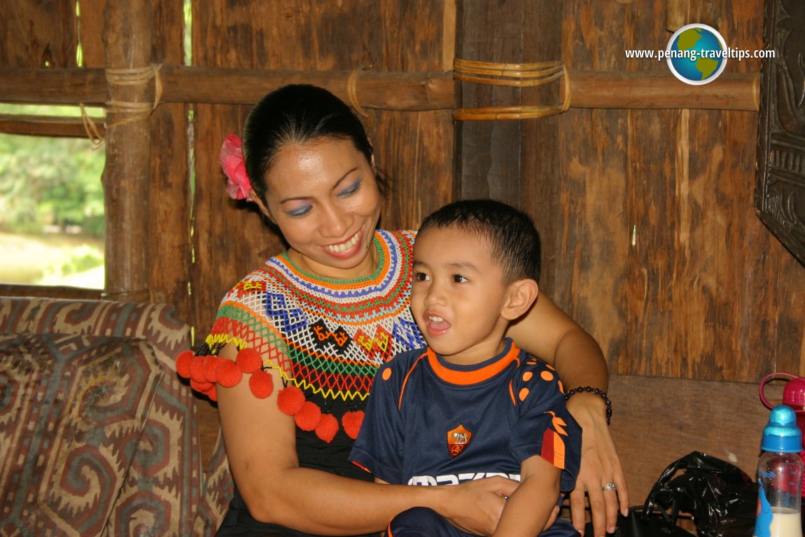 Iban young lady with child