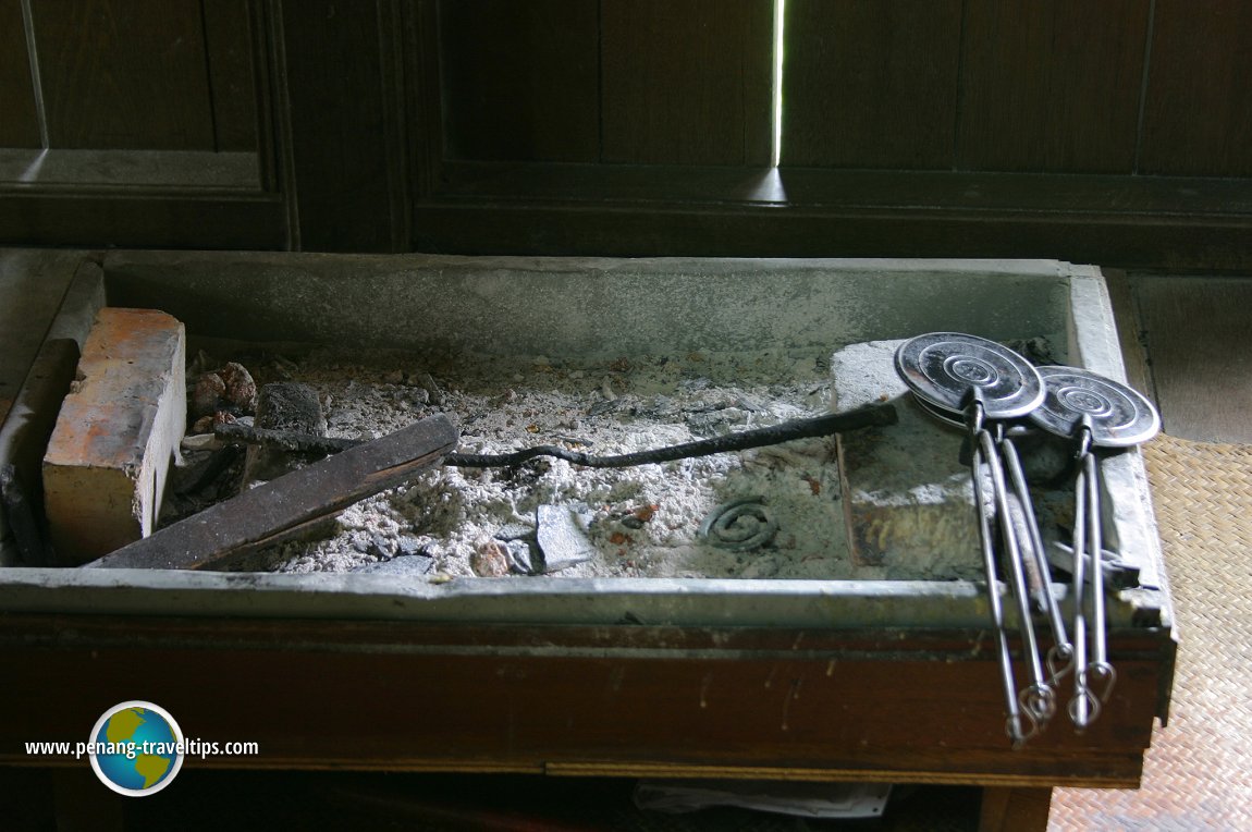 Kuih kapit molds and charcoal stove in the Malay townhouse