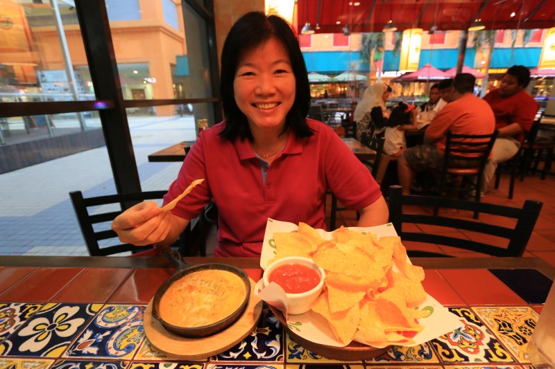 My wife enjoying the spinach queso with tostada chips
