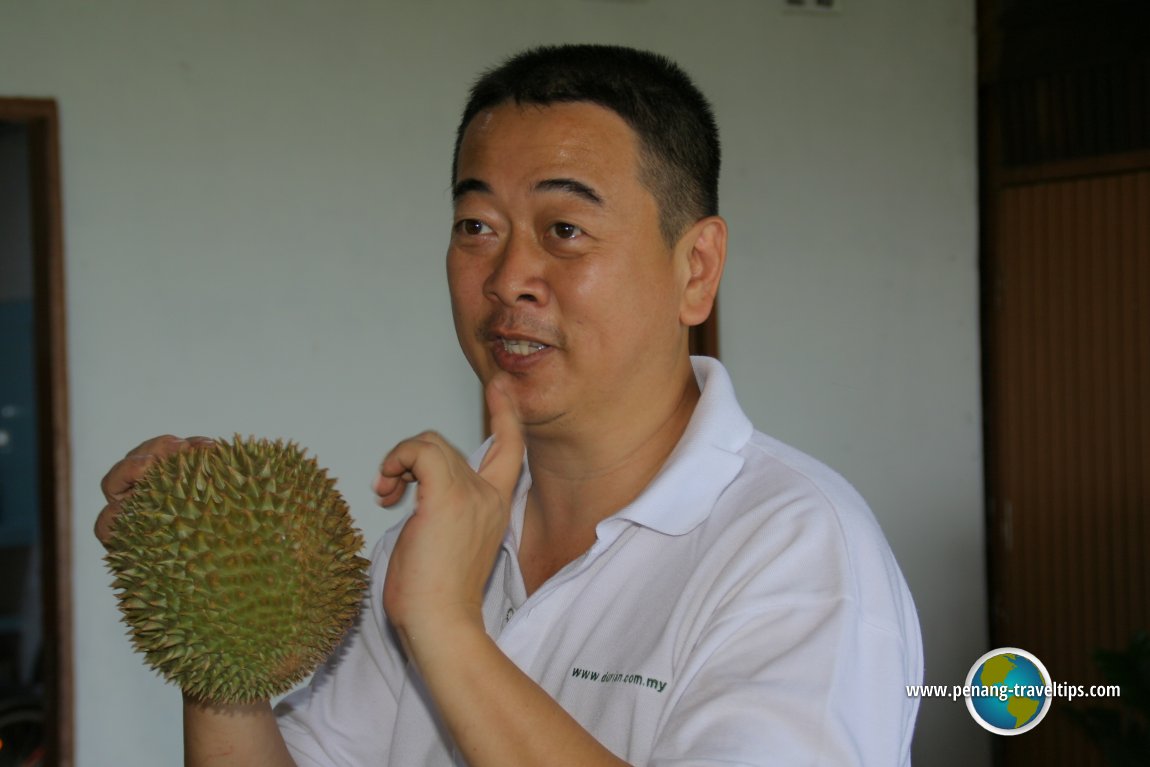 Durian Seng explaining how durian is appraised