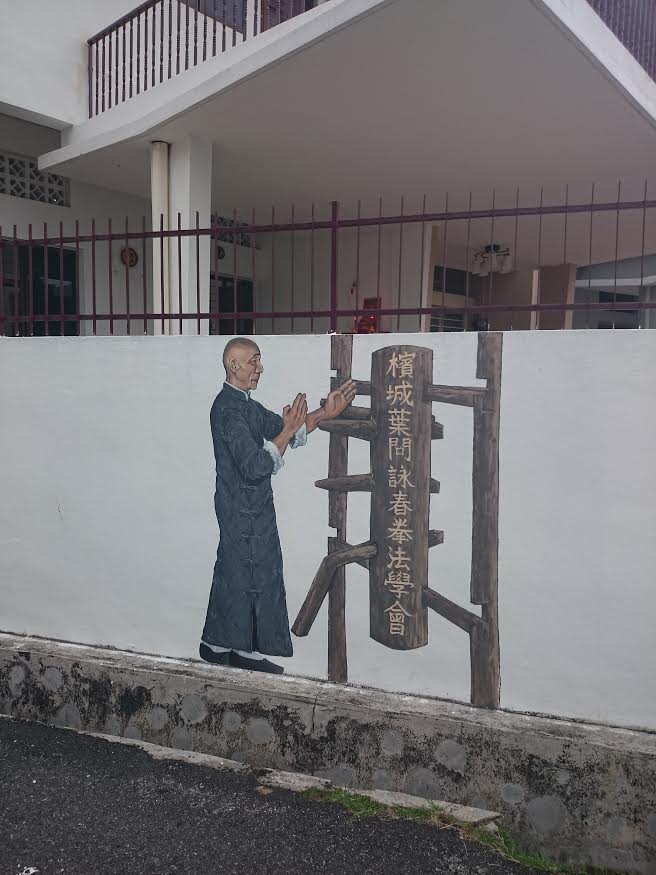 Ip Man demonstrating Wing Chun movies with wooden dummy
