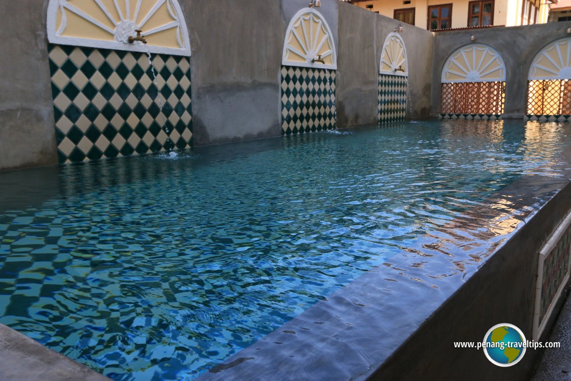 Swimming pool with water features, reminiscent of the water gardens of the maharajahs
