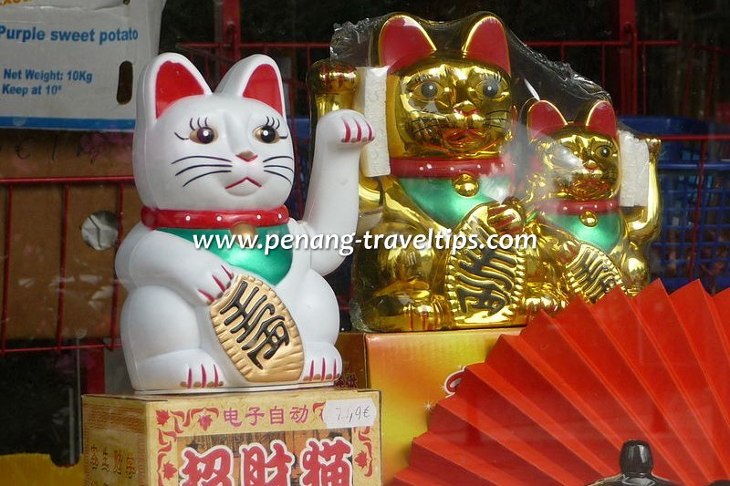 Maneki Neko, the beckoning Fortune Cat installed at many Japanese stores