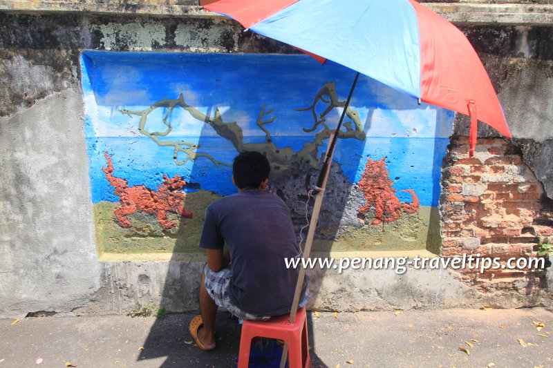 Takayuki Miyazono working on the shisa mural