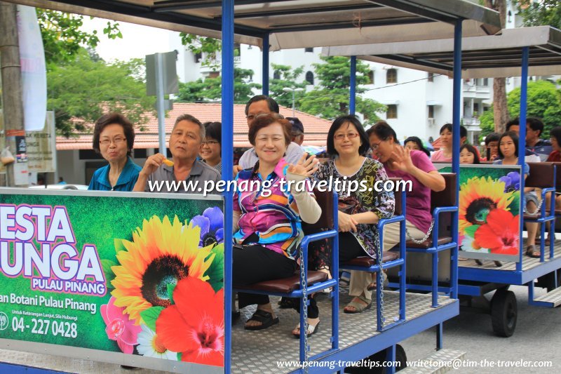 Passengers riding the Botanic Gardens tram