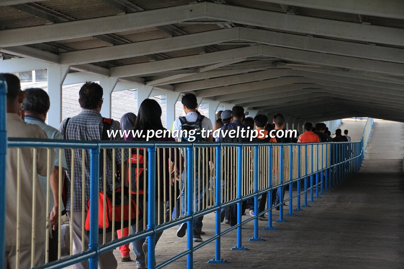 Passengers exiting the Penang Ferry Terminal