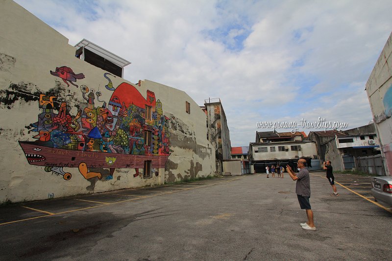 Admirers photographing an Urban Xchange mural