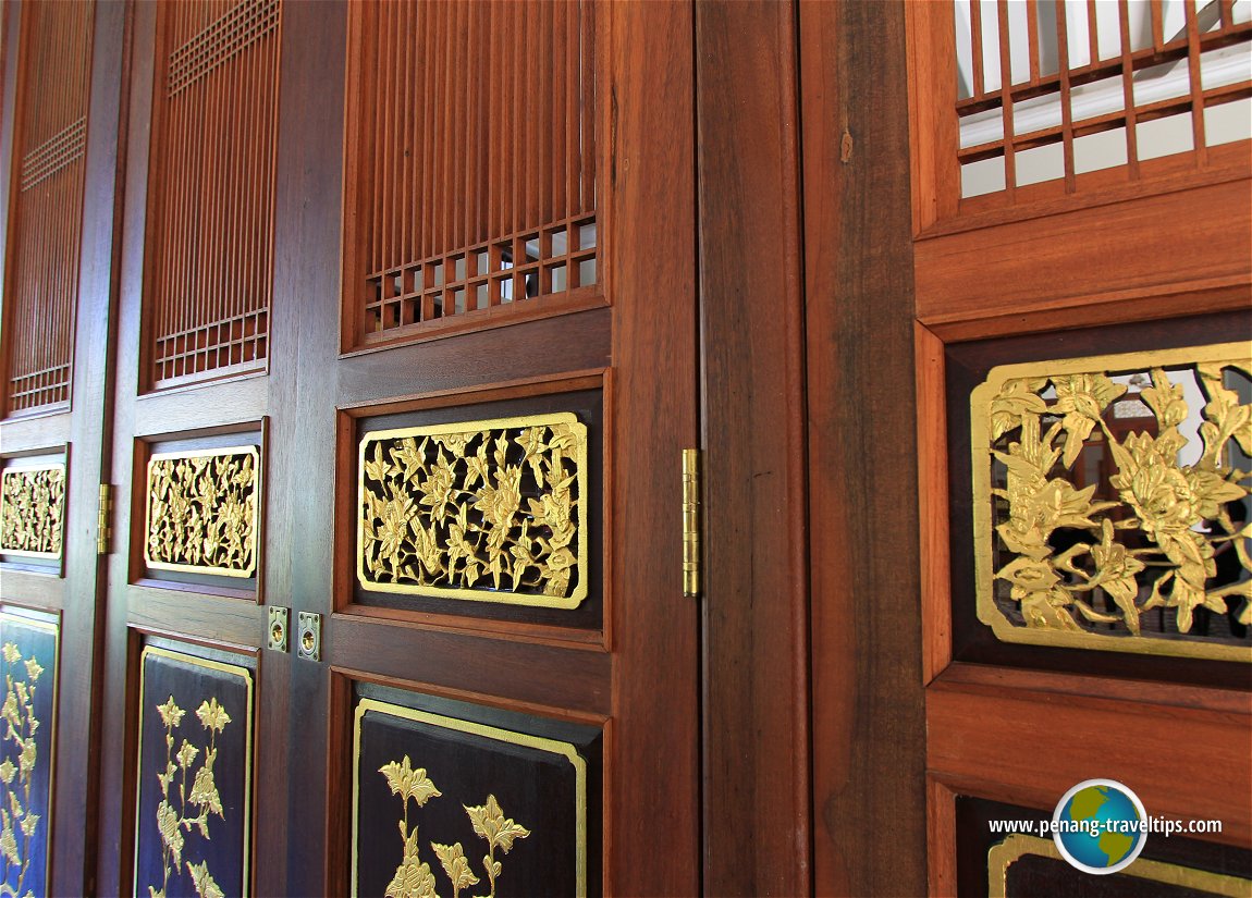 Gilded filigree panels on the screen doors of Seven Terraces