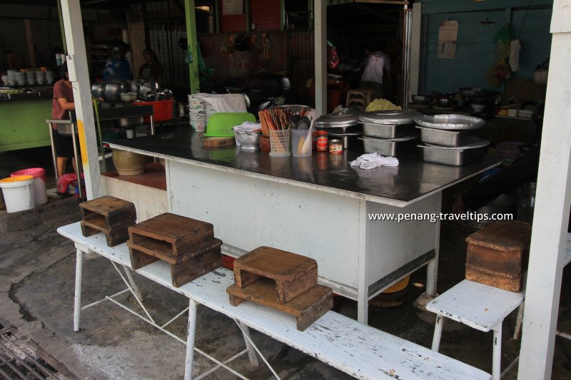 The stools-on-bench seating arrangement at Kedai Kopi Bee Hong