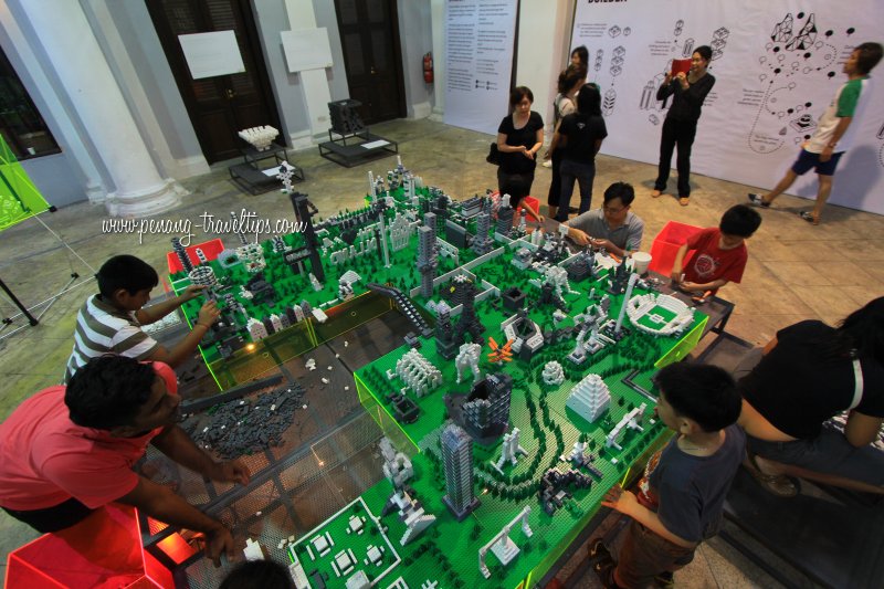 Children playing with the Legos of The Living City, Town Hall