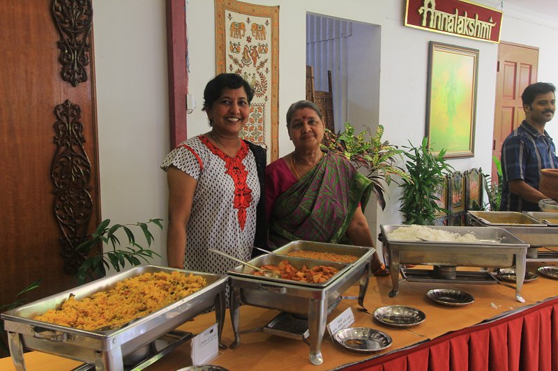 Volunteers serving lunch during the Temple of Fine Arts Founder's Day celebration