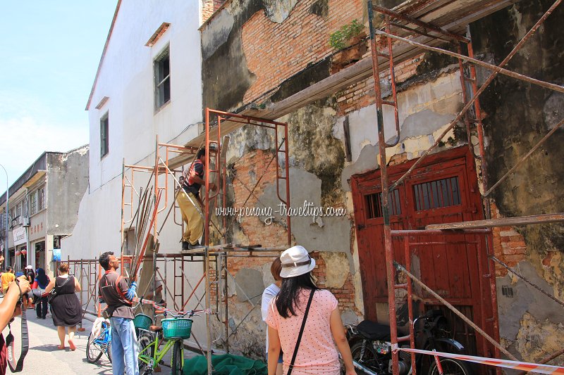Wall where murals are painted undergoing restoration