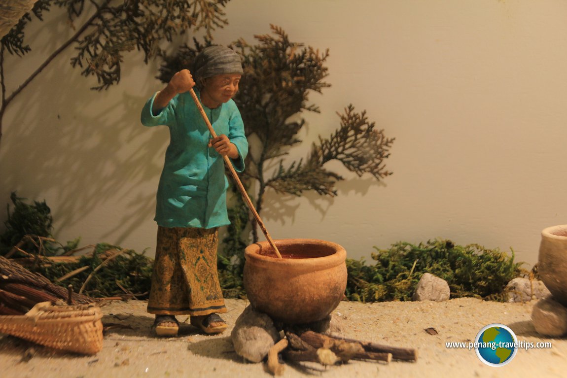 A makcik cooking in the backyard