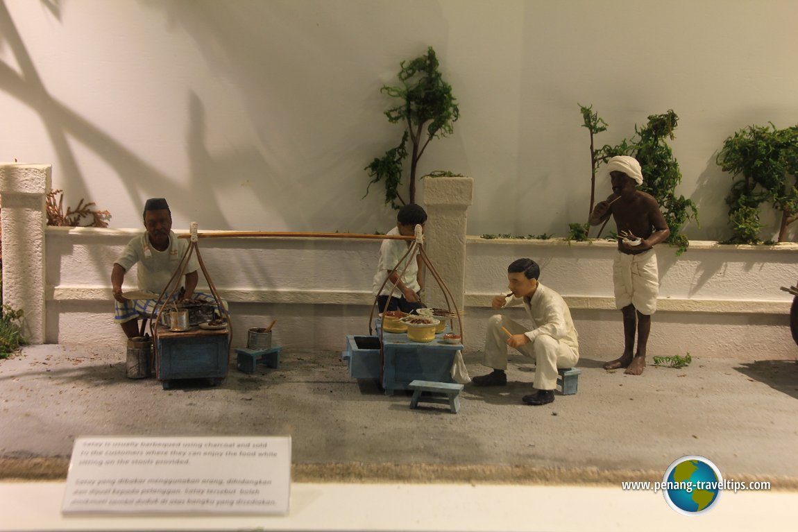 Roadside hawker selling satay