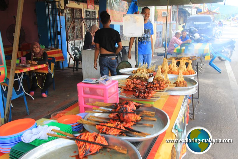 Barbecued chicken and satay on sale by the roadside in Semeling