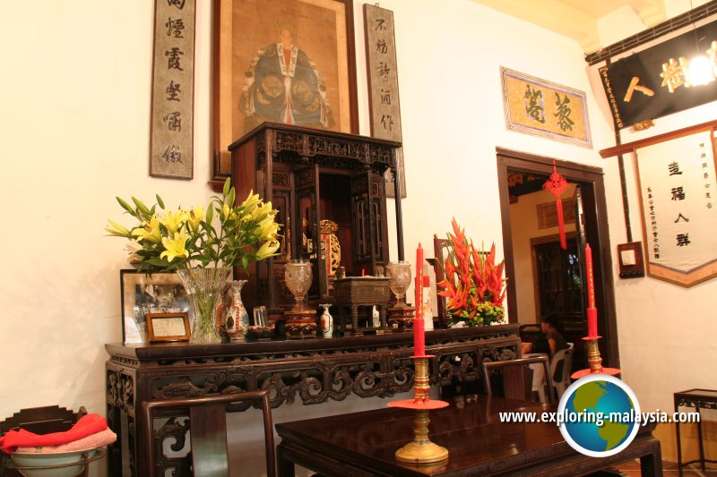 Lee Chye Neo's portrait hanging over the family altar table