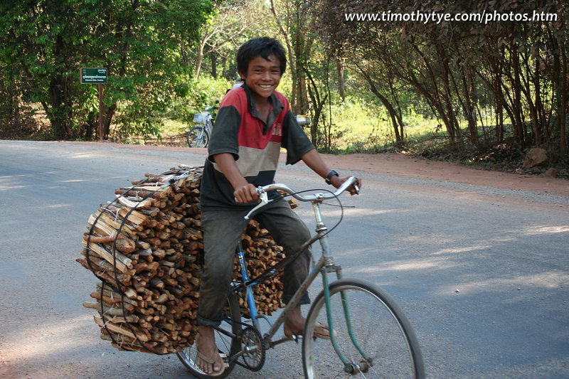Boy transporting wood in Siem Reap