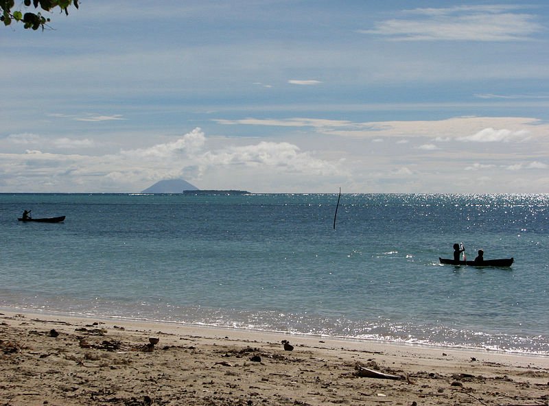 Fenualoa, Solomon Islands, with the active volcano Tinakula in the background