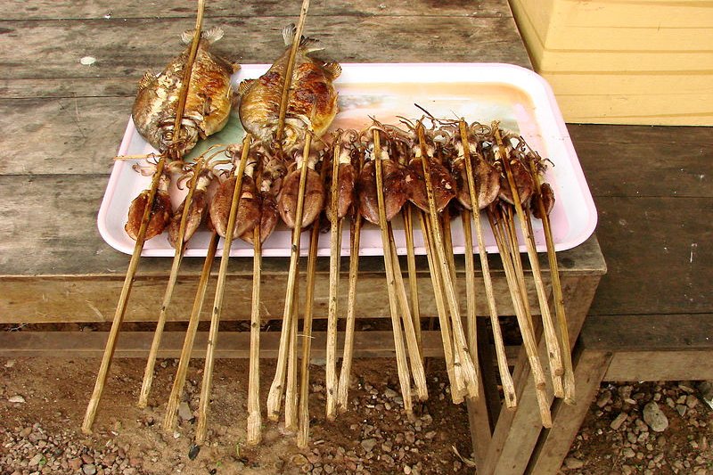 Grilled fish and squid on sale at the market in Kep, Cambodia