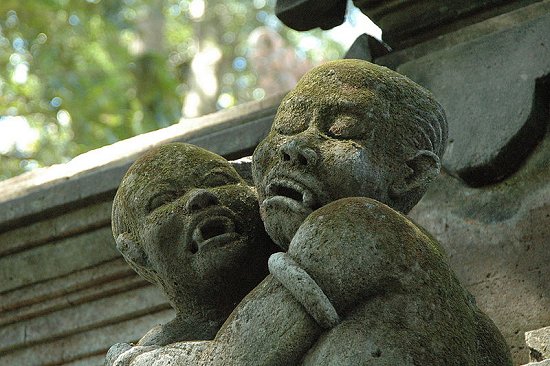 Carvings of vampire children at Pura Dalem Agung Padangtegal