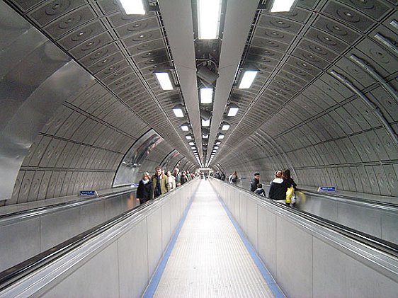 Traveler in Waterloo Tube Station between the Jubilee Line and Northern Line platforms