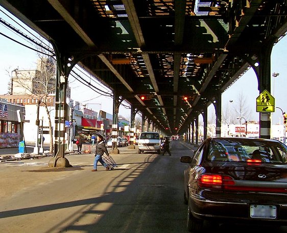 View of Broadway in the Bronx, with the tracks of the 1 train overhead