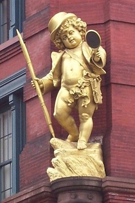 Gilded statue of Puck on Puck Building, at Lafayette and Mulberry Streets