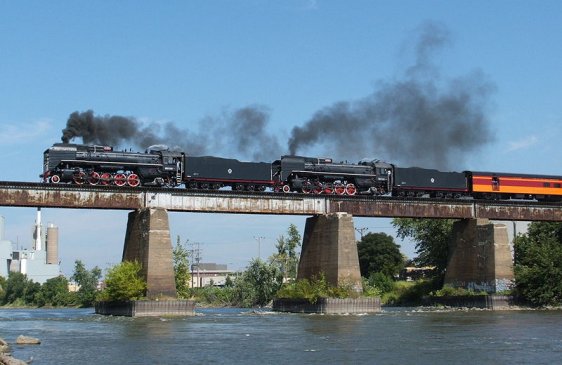 Two China Railways steam trains crossing the Iowa River at Iowa City