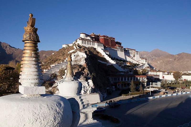 View of Tibetan stupas and the Potala Palace