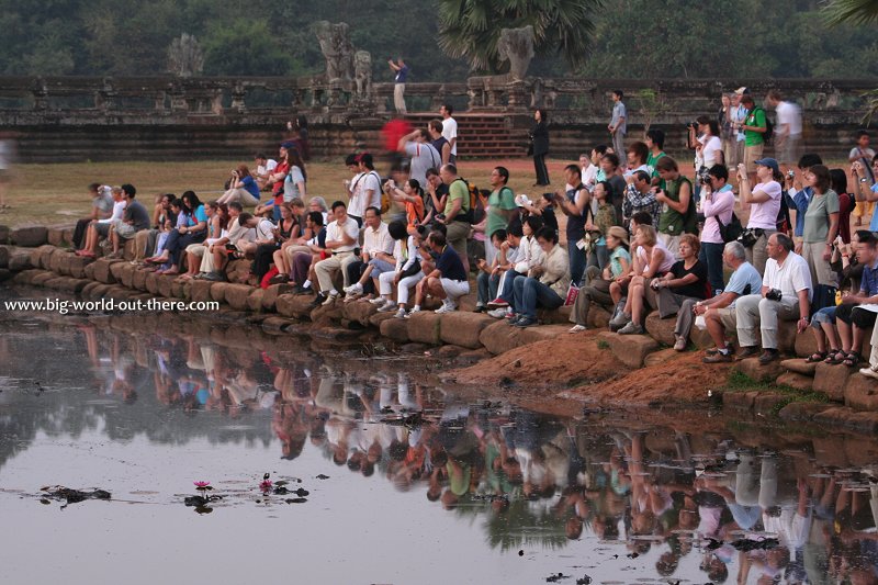 Tourists watching sunrise at Angkor Wat