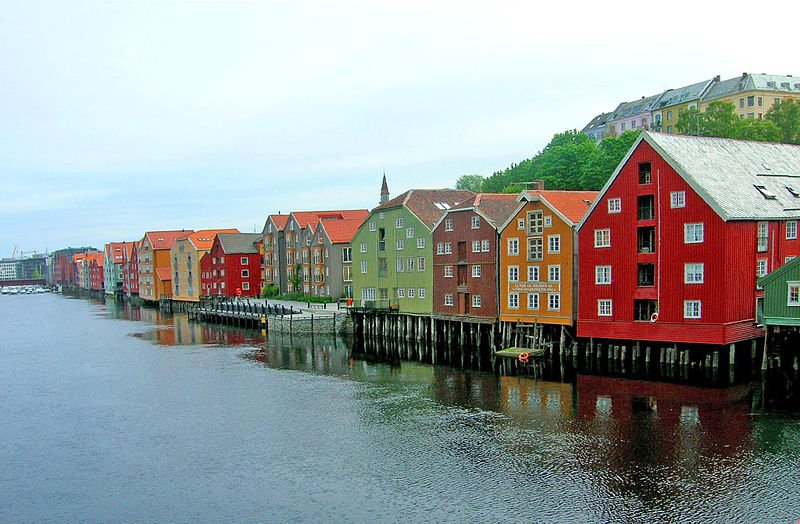 Restored warehouses on stilts by the wharves of Trondheim, Norway