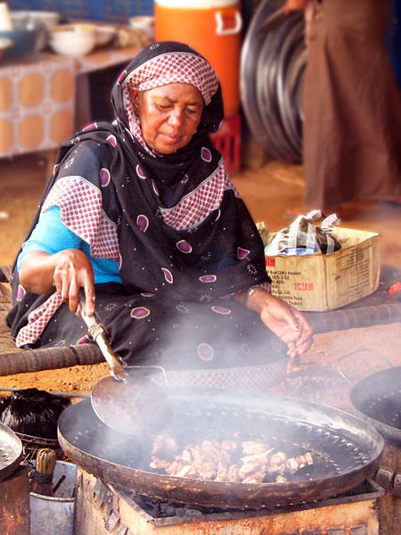 Woman preparing food, Sudan