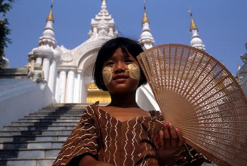 Young fan vendor at Atumashi Kyaung Monastery, Mandalay