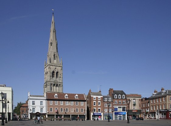 View of the Market Square at Newark-on-Trent, Nottinghamshire, England, with the steeple of the Church of St Mary Magdalene