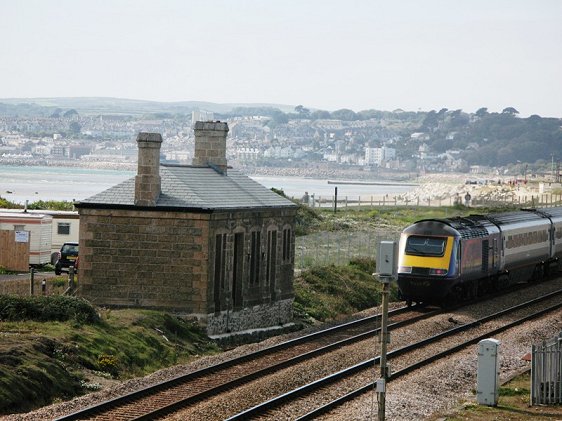 Train of the First Great Western service passing disused station at Marazion, Cornwall