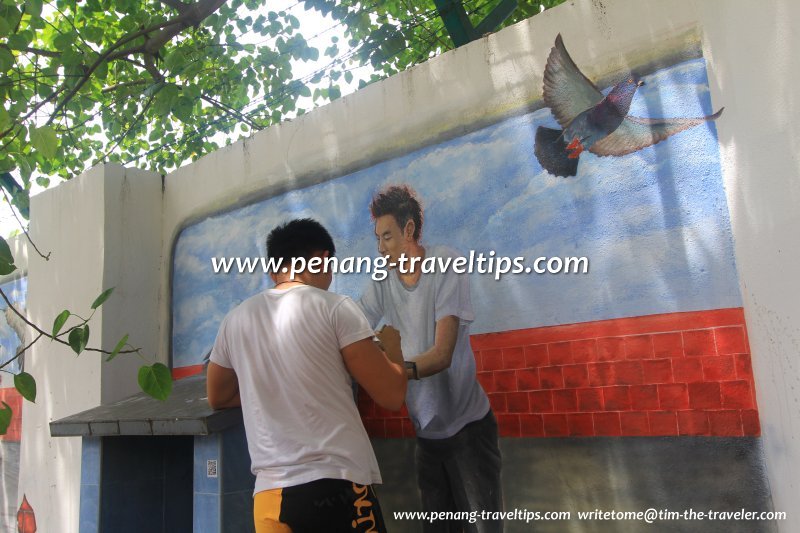 Art at work: Wall Art Team artist completing the mural