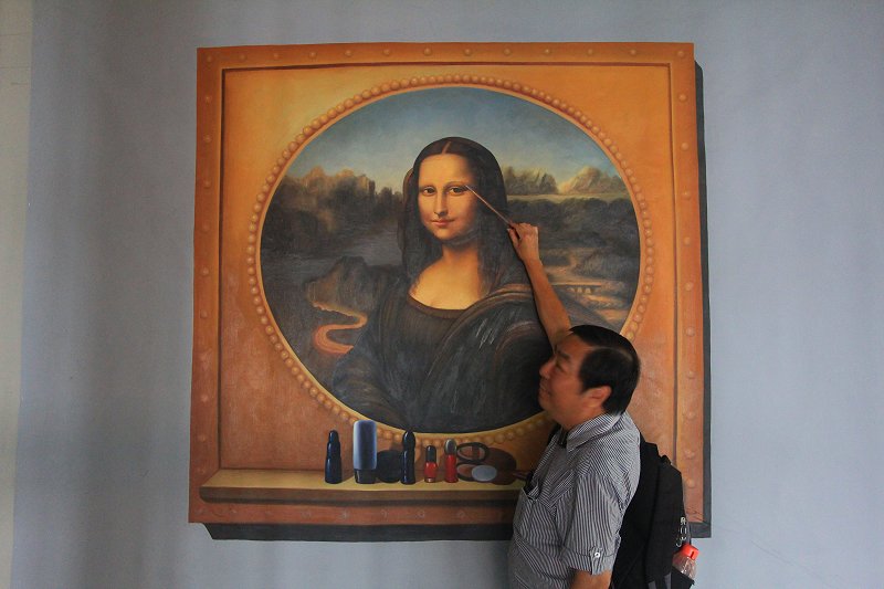 Eden General Manager Bertie Tye applying make-up on the Mona Lisa