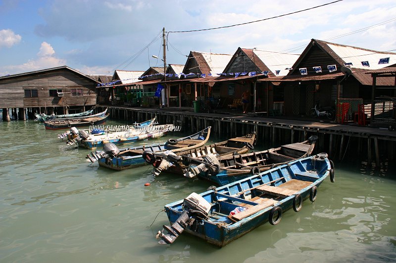 Boats lining Chew Jetty