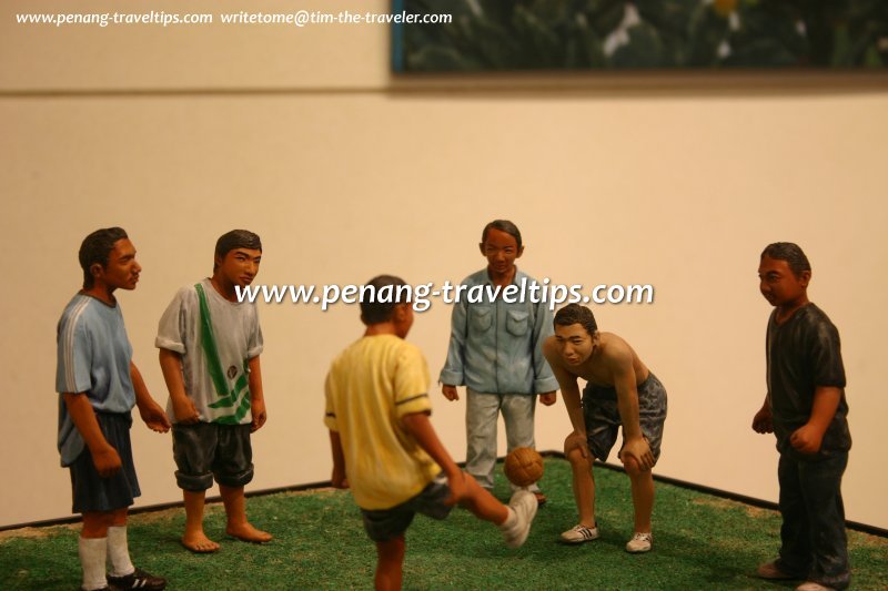 Boys playing sepak takraw, a traditional ball game