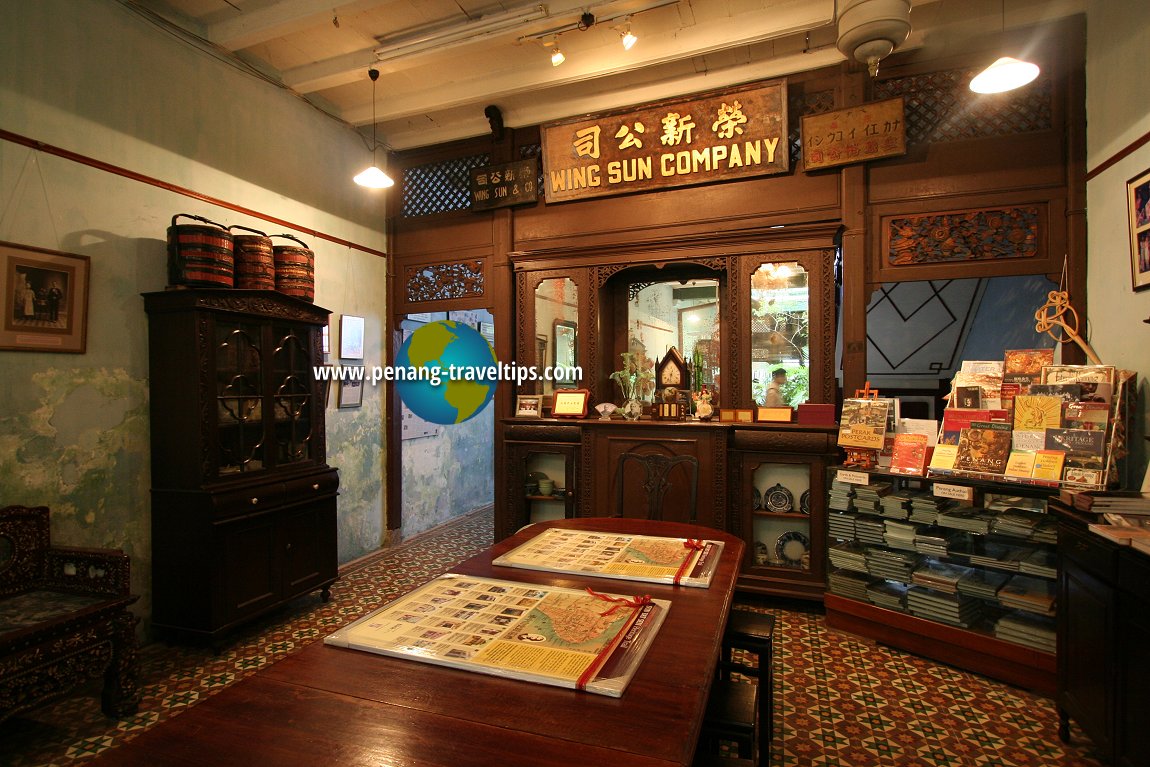 The dining hall at 120 Armenian Street, with the former company plaque